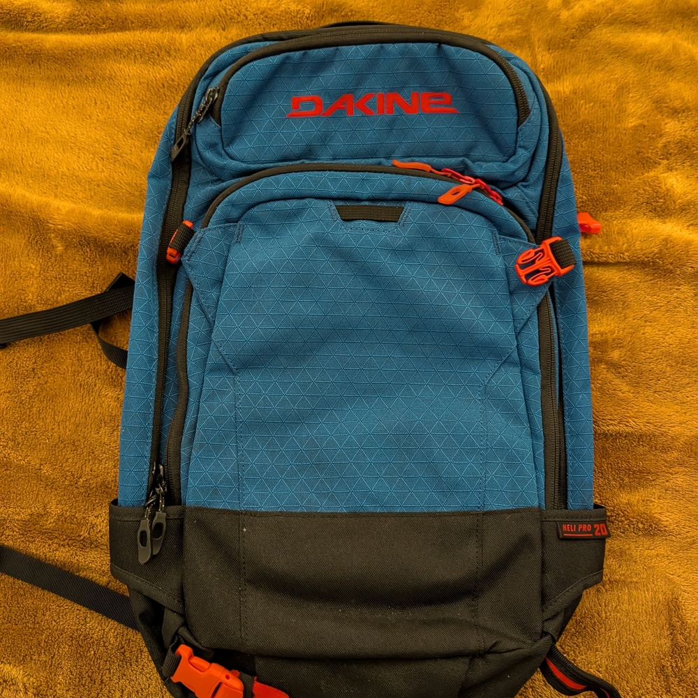 Dakine Blue and Black Backpack with Red Accents
